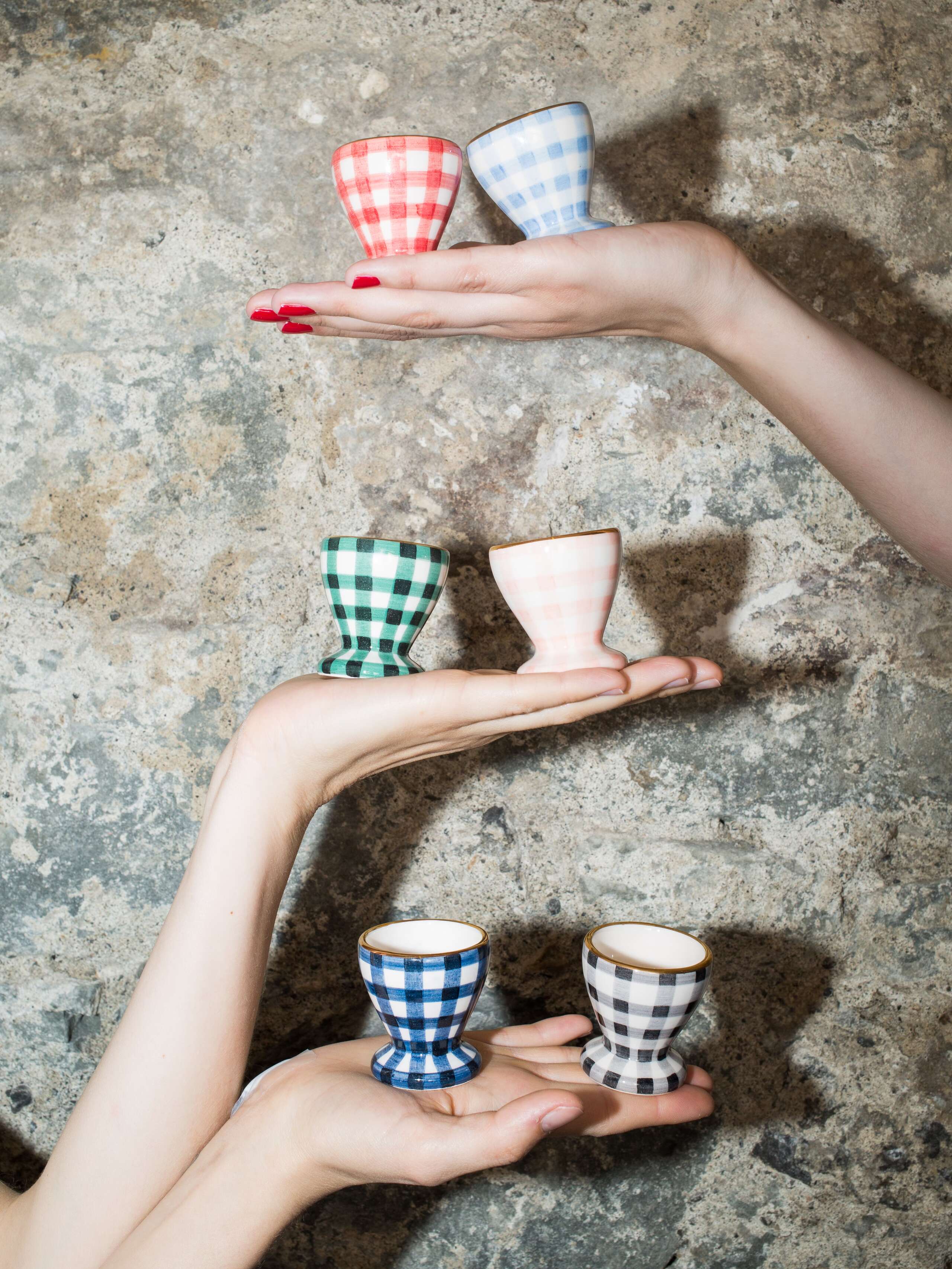 person holding egg cups