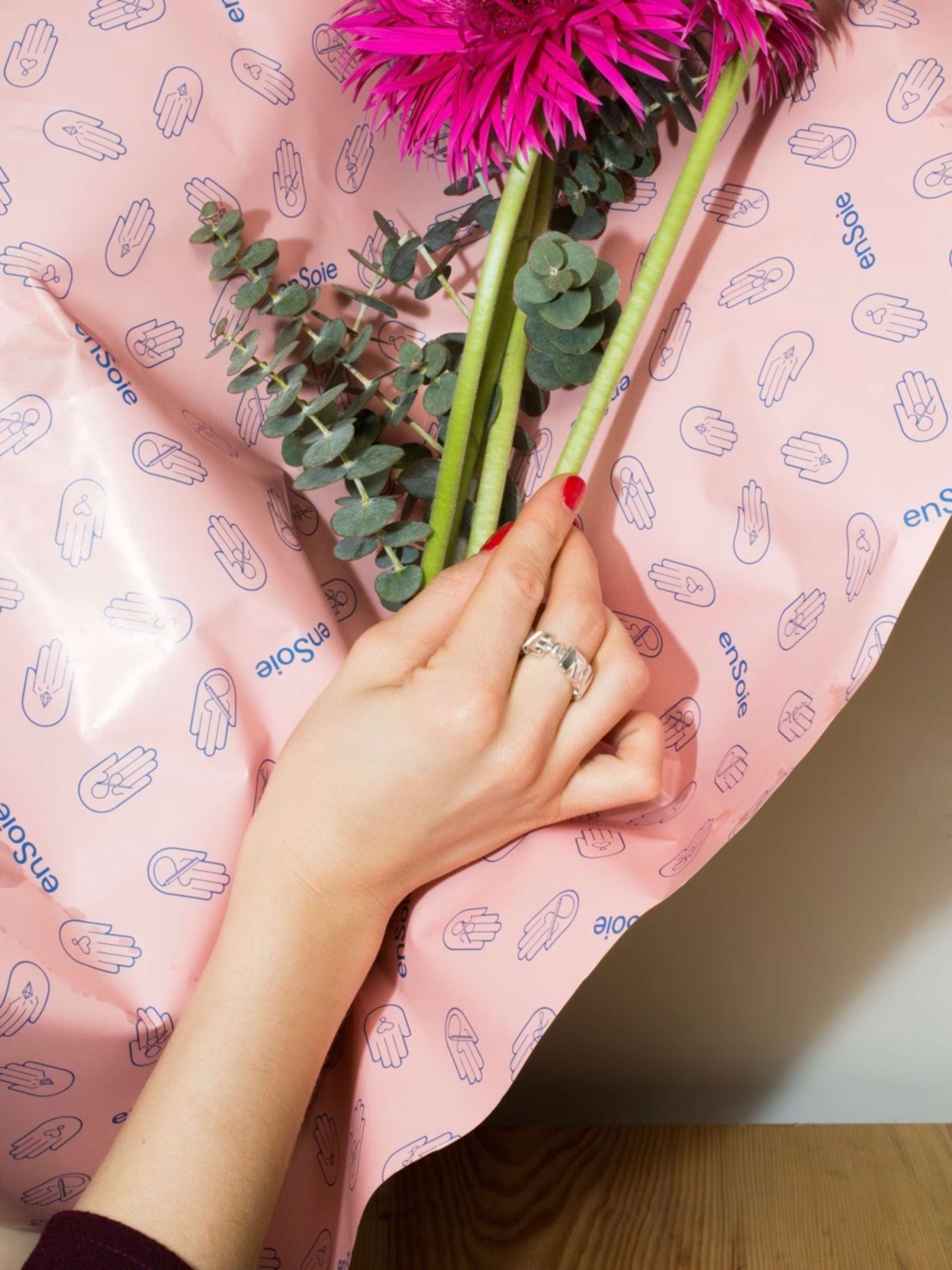 person wearing love ring