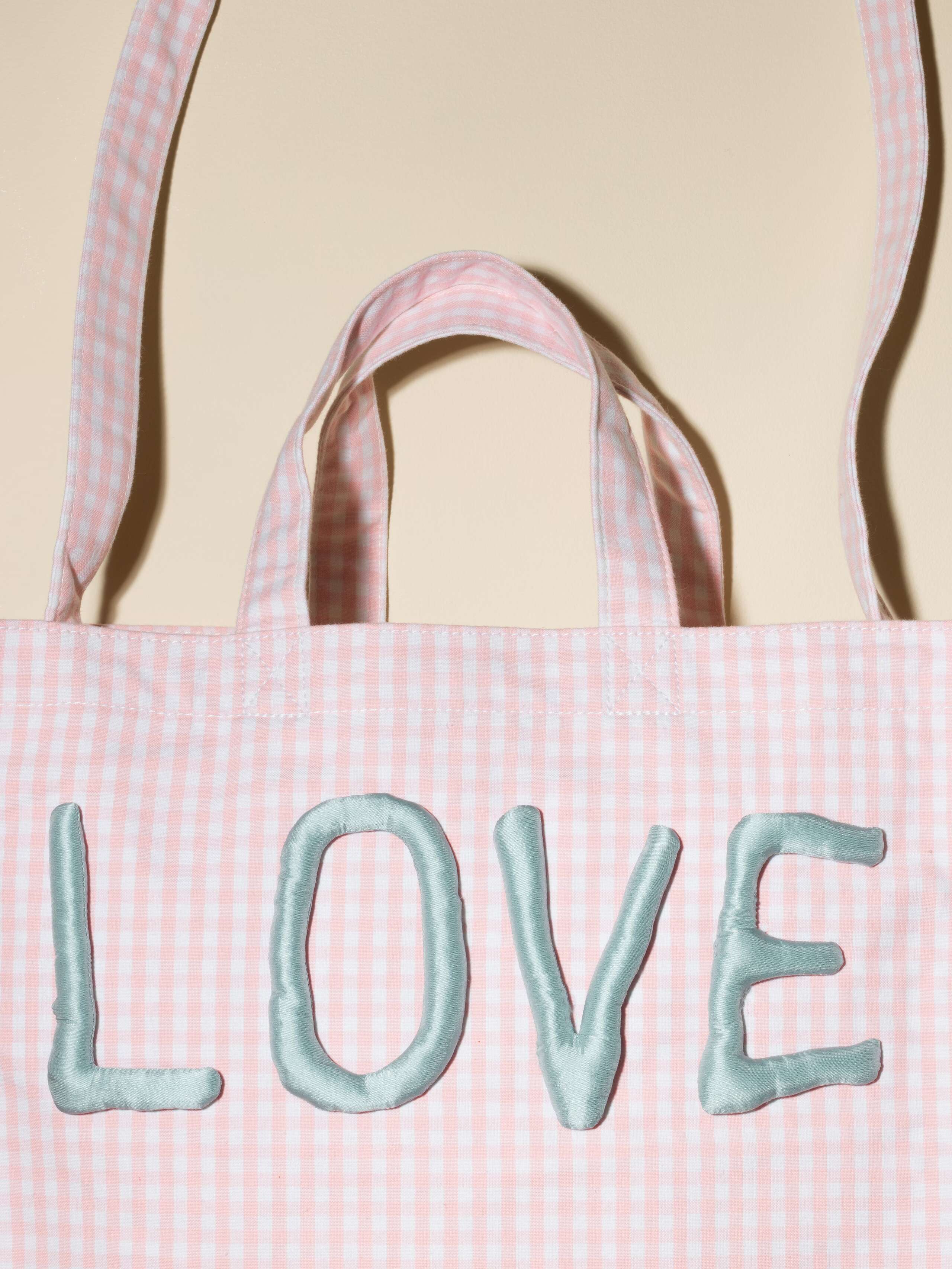 beautiful bag in light pink shade with vichy pattern and LOVE application