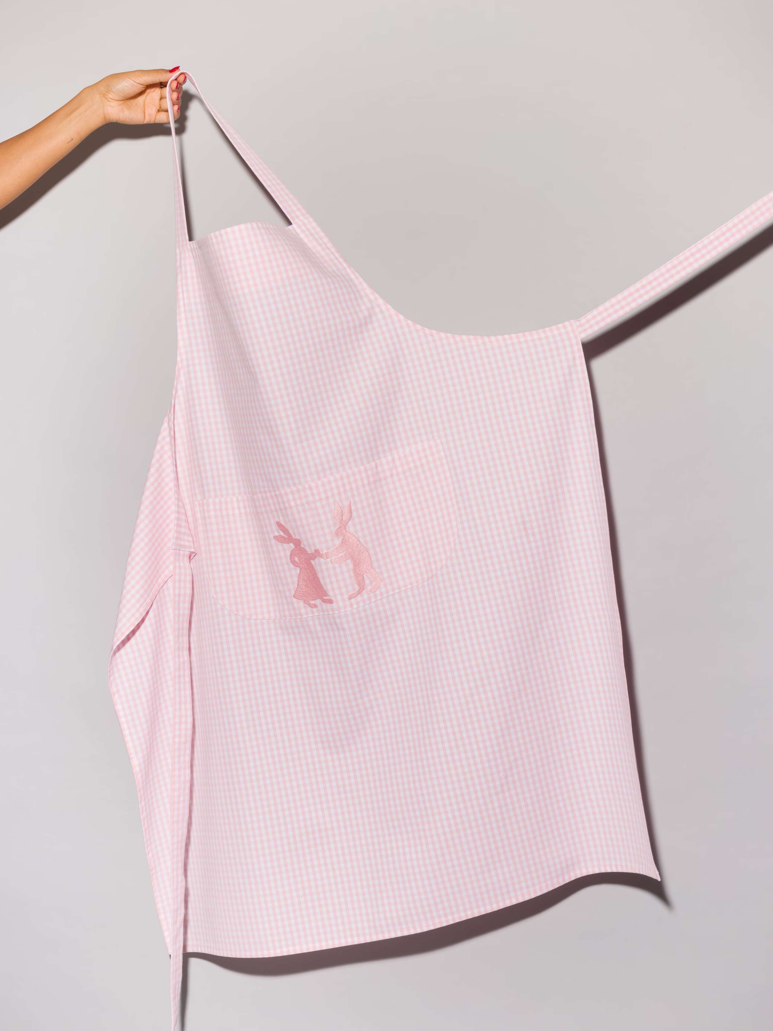 Vichy cotton apron with hand embroidery of dancing rabbits in pink