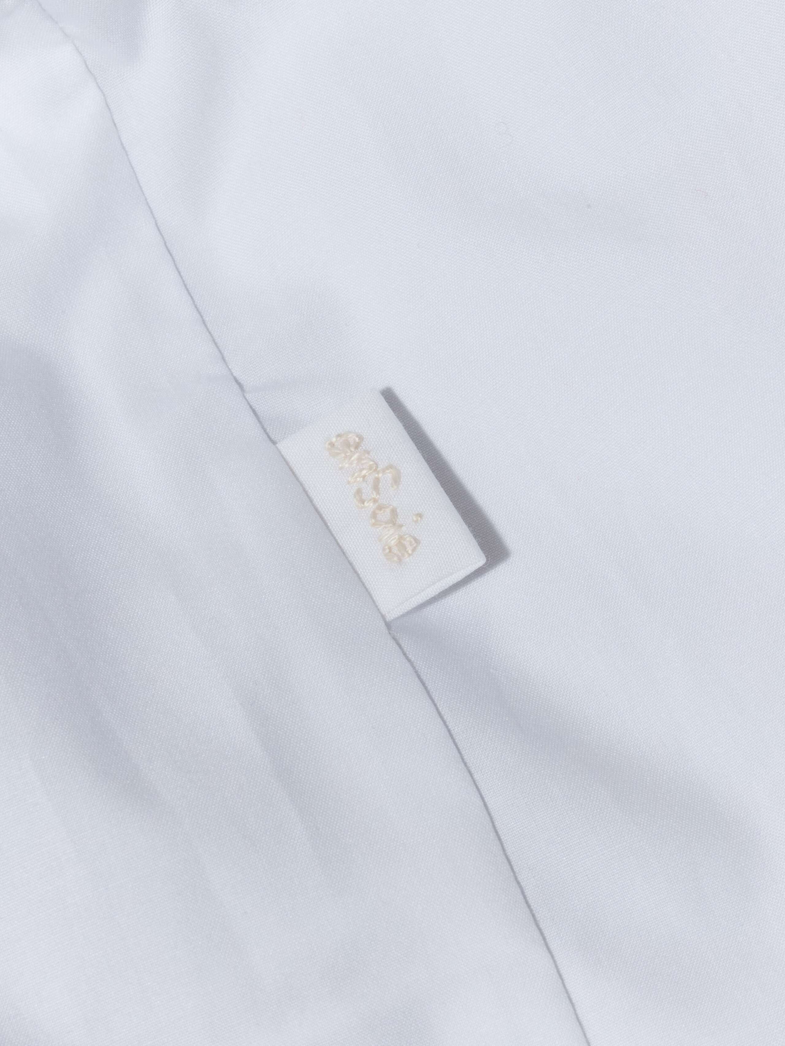 Festive, white poplin cotton baby body with collar handmade in Zurich
