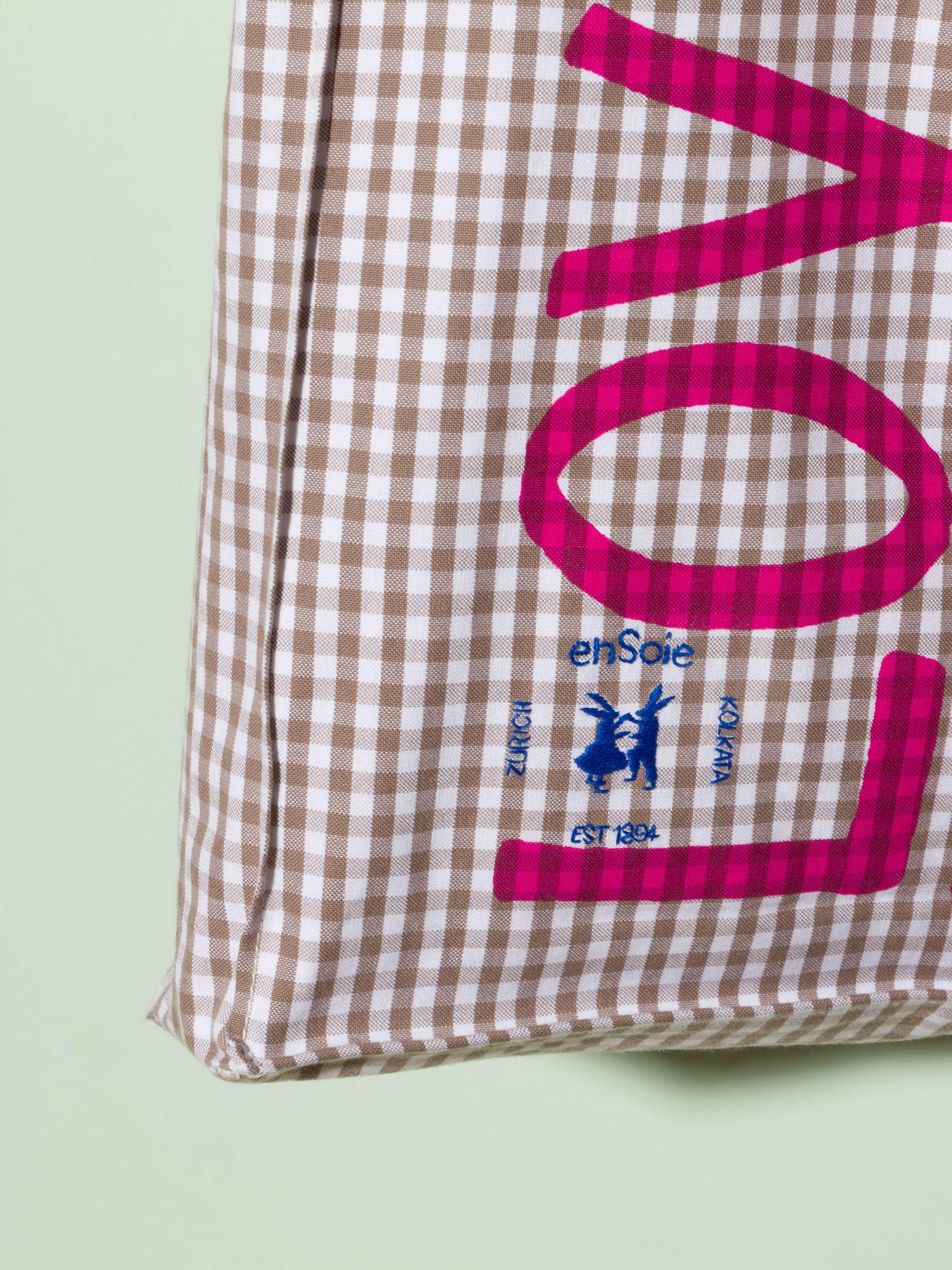  cotton tote bag with a beige vichy pattern and a pink print that says "Love rules forever" and a rabbit ebroidery