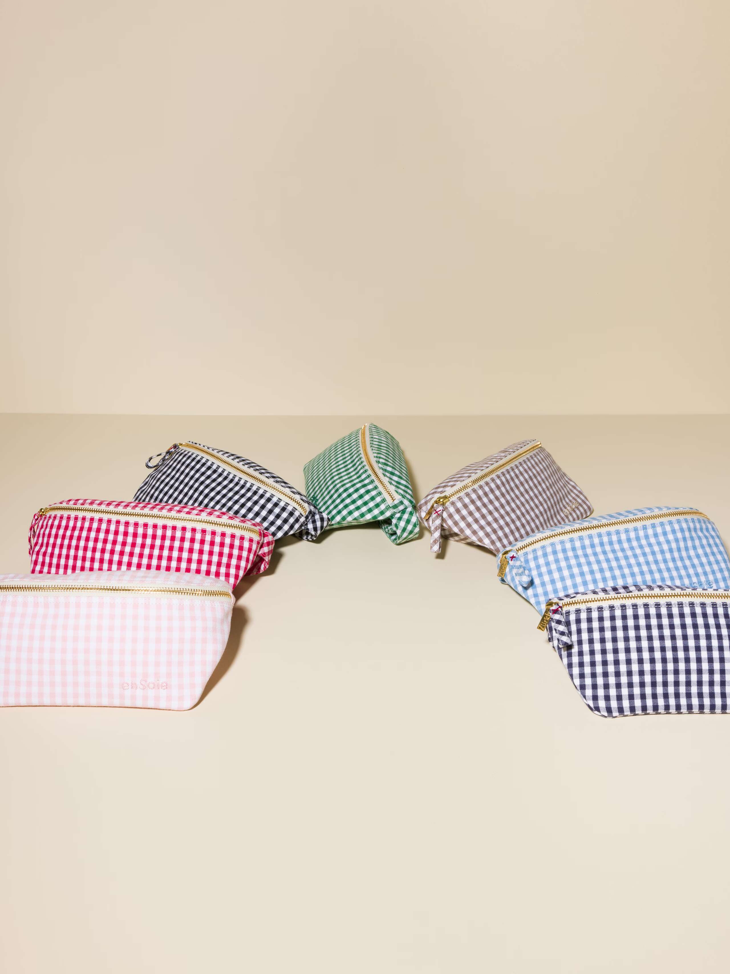 Picture of seven cute cotton hip bags featuring colourful vichy check patterns and a striped patterns