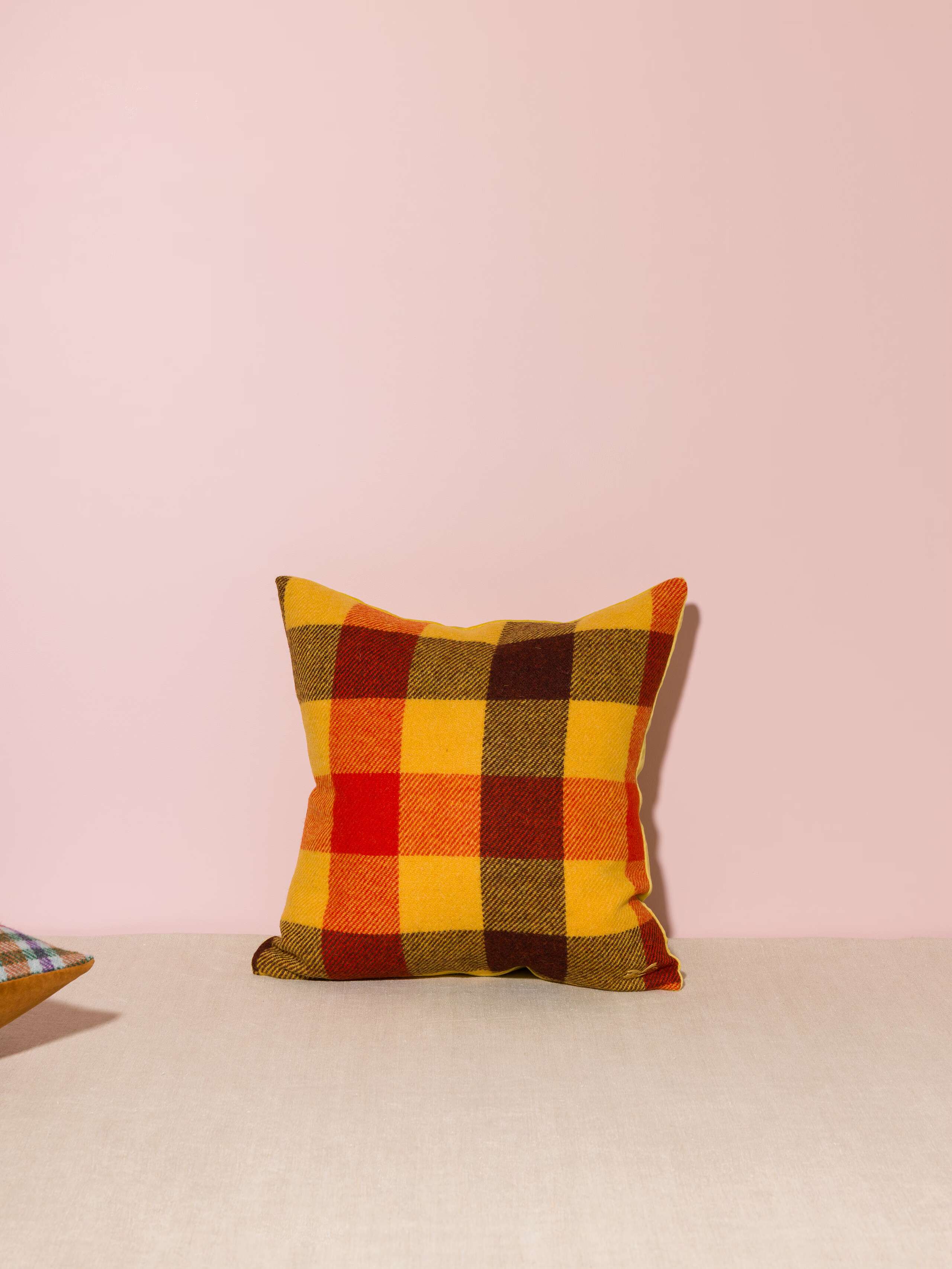 Picture of a beautiful pillow cover made of colourful Harris Tweed and yellow cotton velvet