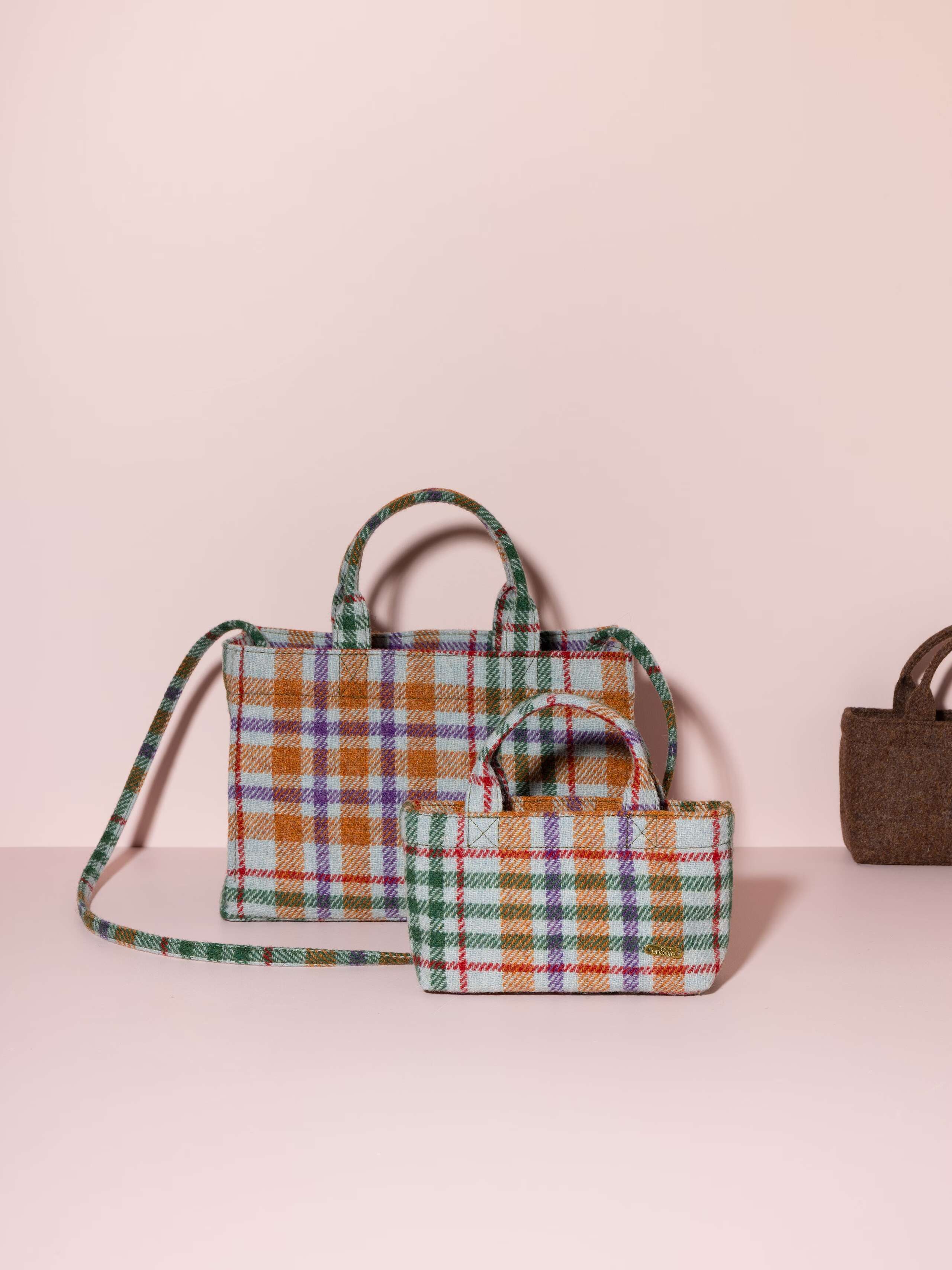Picture of two handbags made of colourful harris tweed wool fabric 