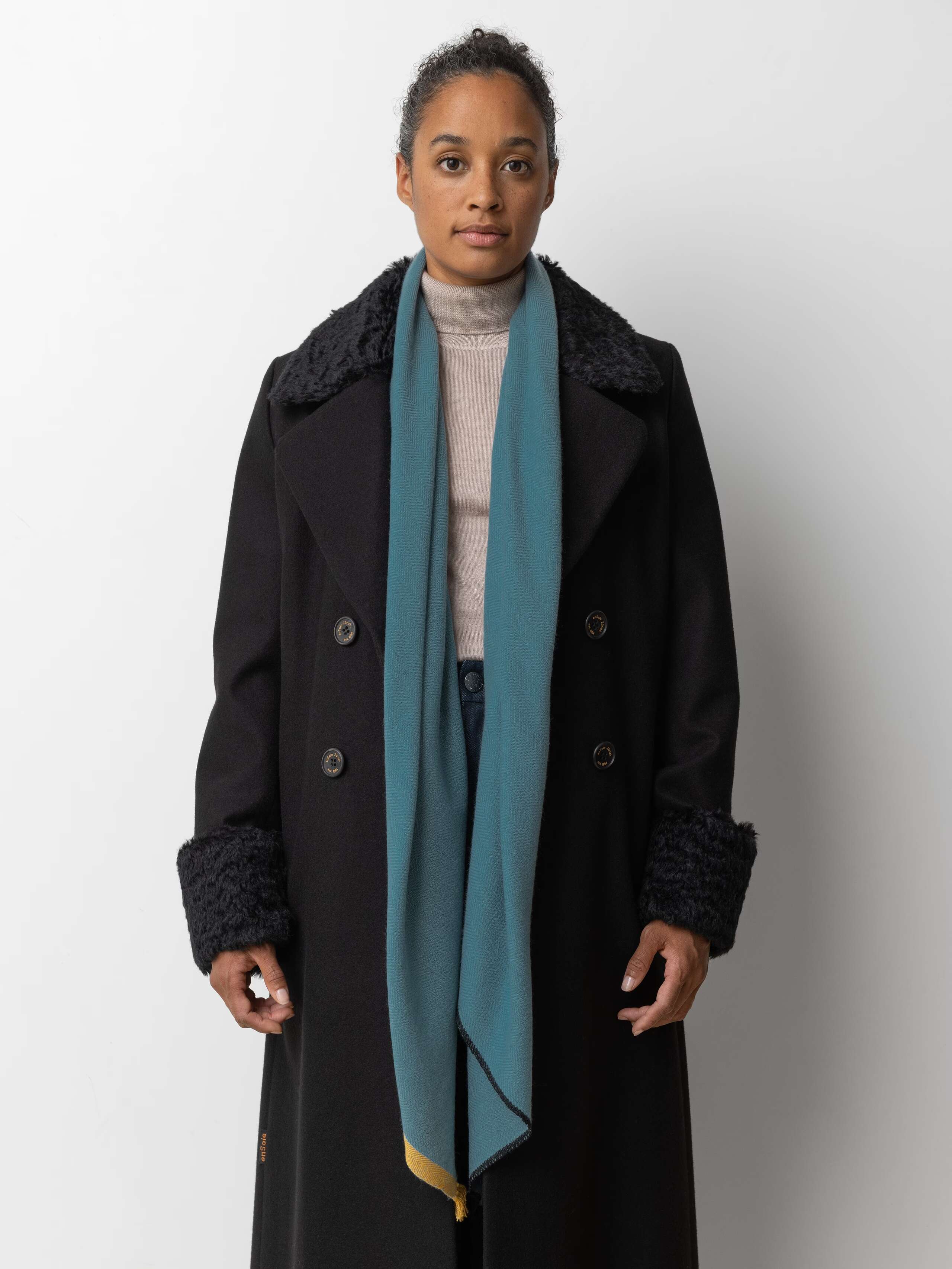 Picture of a female model wearing a blue cashmere stole