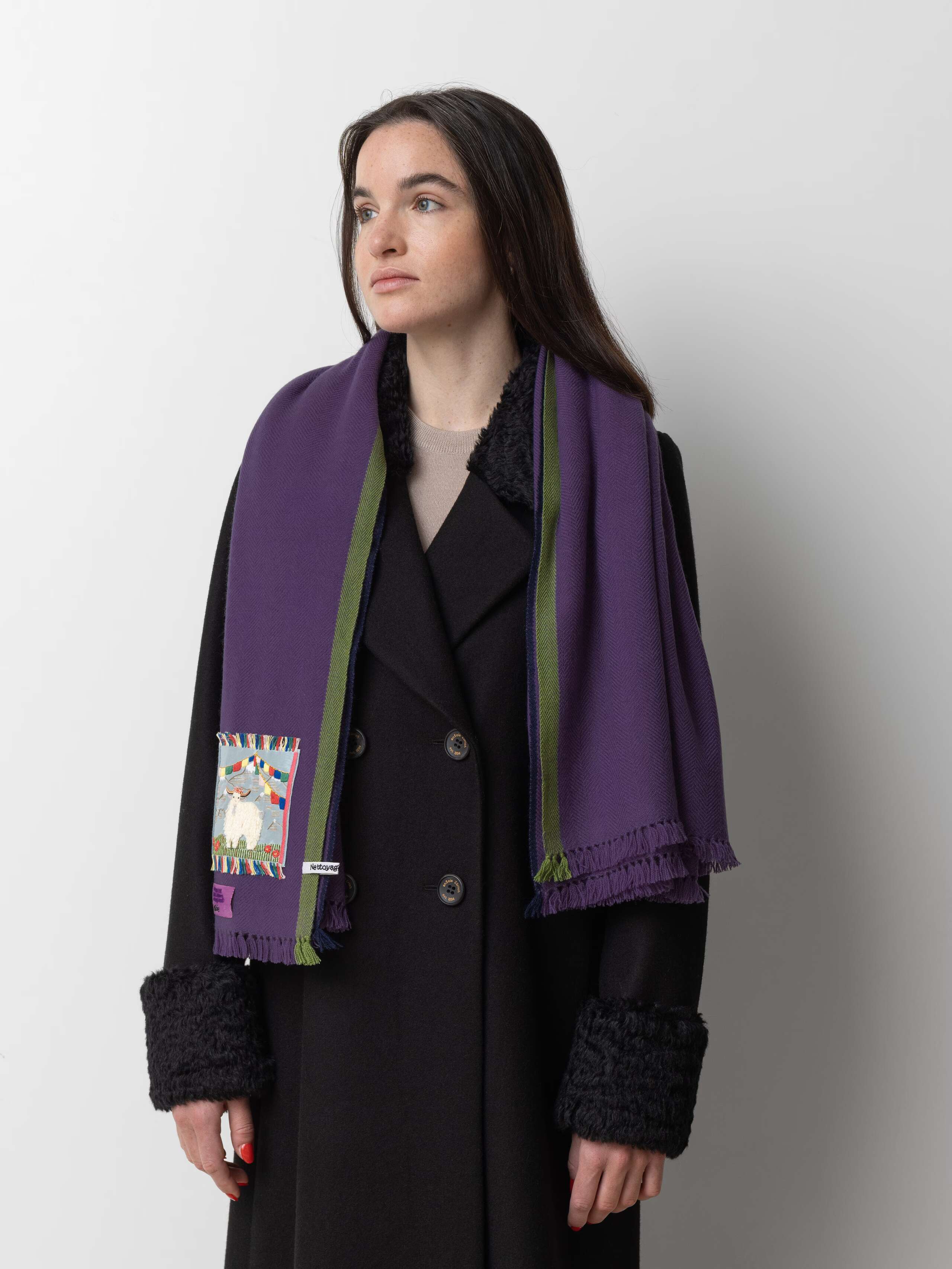 Picture of a female model wearing a purple cashmere stole