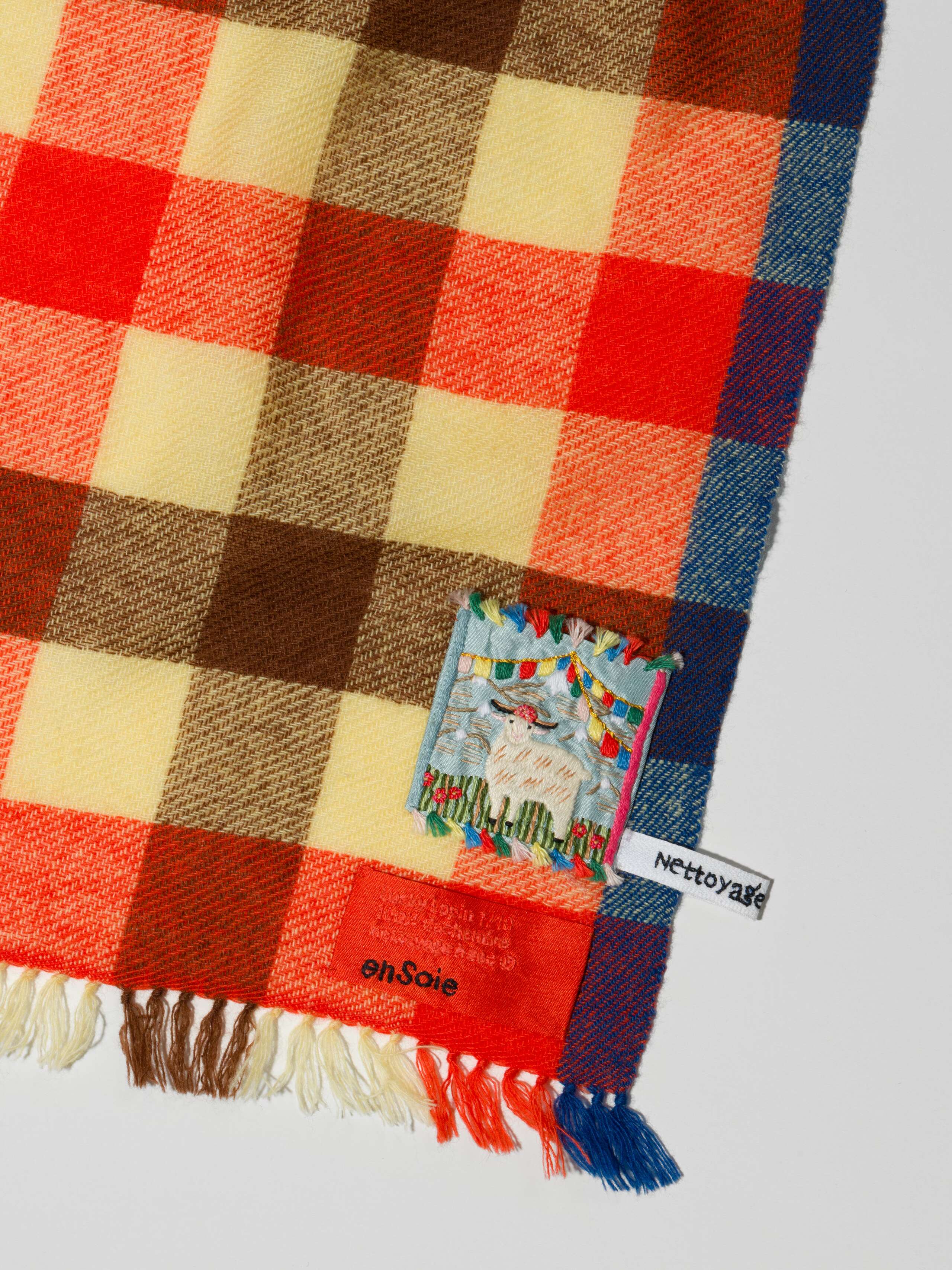 Detail Shot of Blia mini Stole in cashmere in a multicolour check pattern lucky lapin